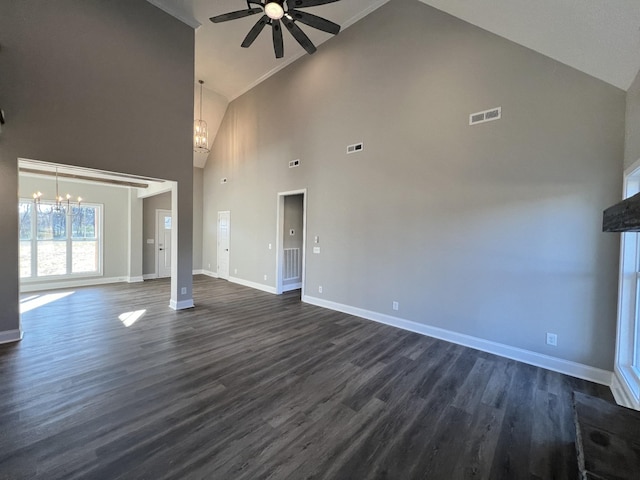 unfurnished living room featuring ceiling fan with notable chandelier, dark hardwood / wood-style floors, and high vaulted ceiling