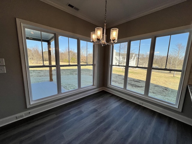 unfurnished dining area featuring a chandelier, dark hardwood / wood-style floors, and ornamental molding