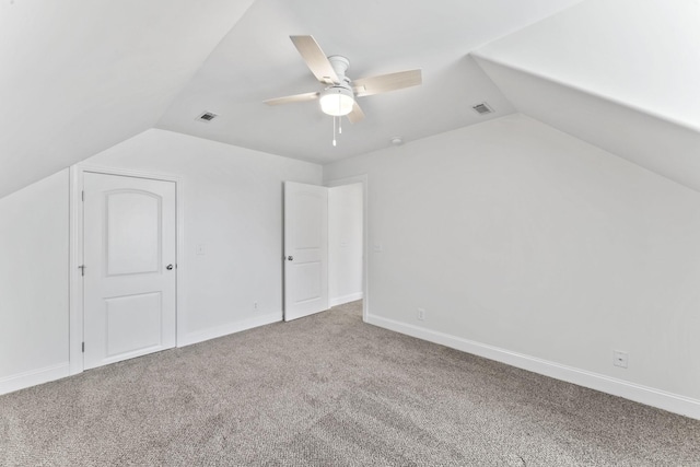 bonus room featuring ceiling fan, carpet, and vaulted ceiling