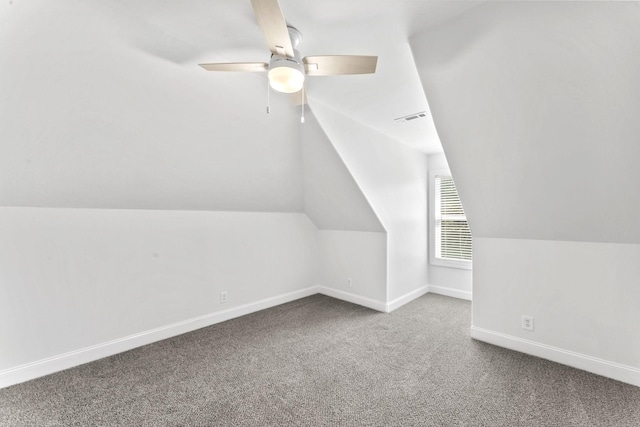 bonus room featuring ceiling fan and carpet