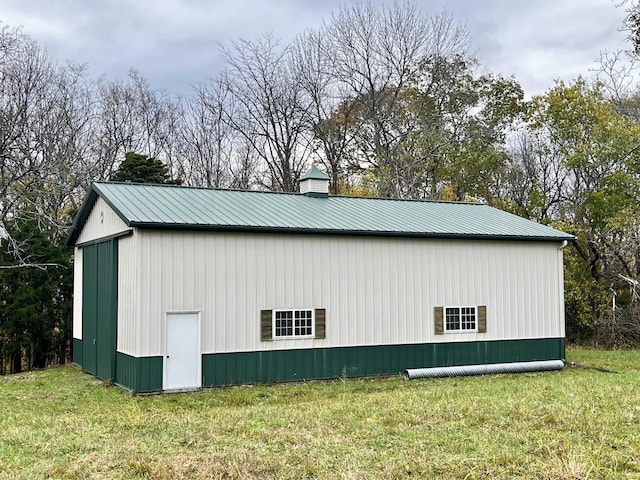 view of side of home featuring a lawn