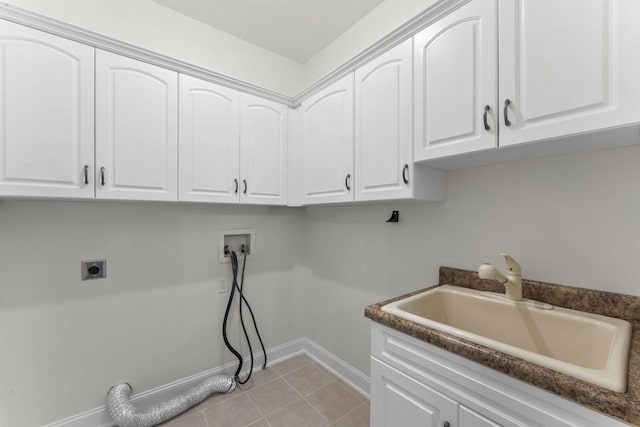 laundry room featuring cabinets, sink, hookup for a washing machine, light tile patterned floors, and hookup for an electric dryer