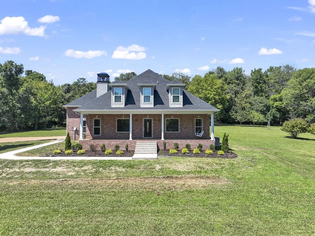 view of front of house with a front lawn and covered porch