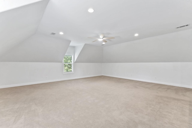 bonus room with ceiling fan, light colored carpet, and lofted ceiling