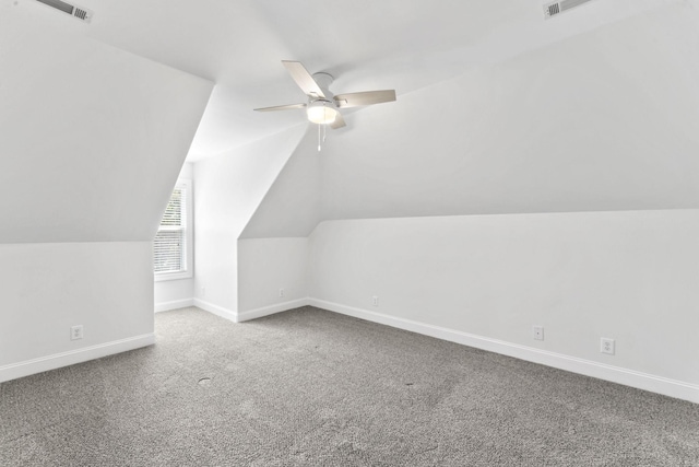 additional living space with ceiling fan, carpet, and vaulted ceiling