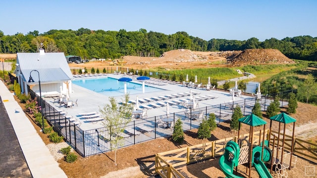 view of pool with a water view