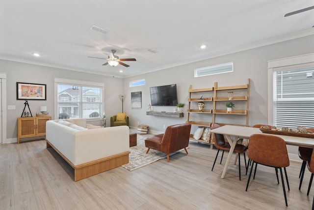 living room with ceiling fan, light hardwood / wood-style floors, and ornamental molding