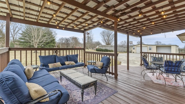 wooden terrace featuring outdoor lounge area and an outdoor structure