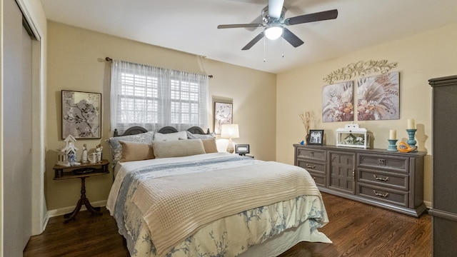 bedroom featuring ceiling fan, dark wood-type flooring, and a closet