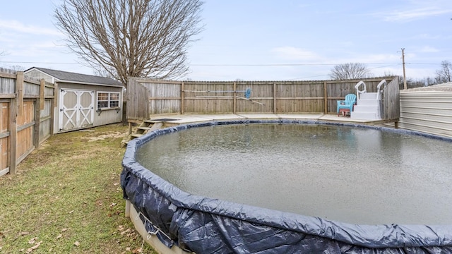 view of swimming pool with a storage shed