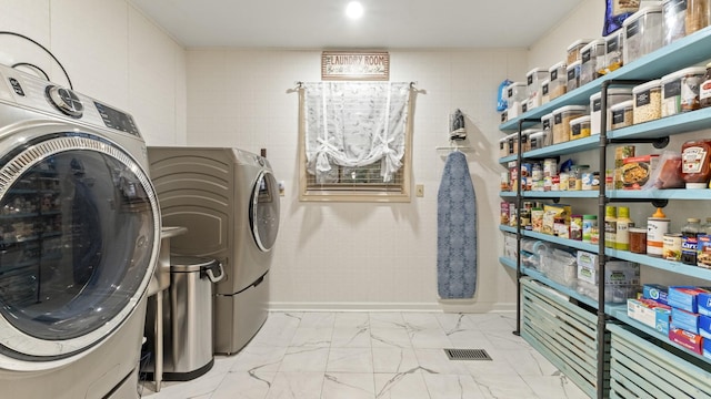 laundry area with washing machine and dryer