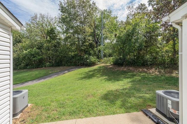 view of yard featuring central AC unit