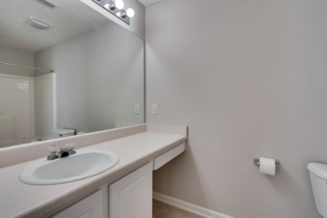 bathroom with tile patterned floors, vanity, and toilet