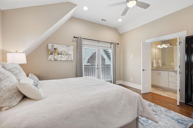 bedroom featuring access to exterior, ceiling fan, hardwood / wood-style flooring, connected bathroom, and lofted ceiling