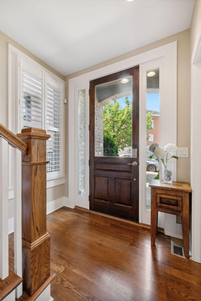 entryway featuring dark wood-type flooring