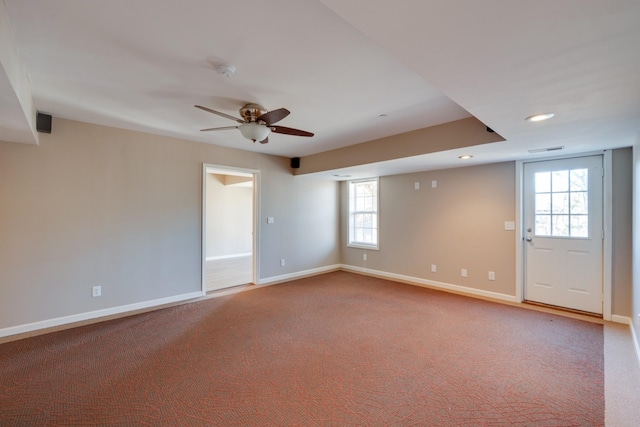 spare room with carpet and ceiling fan