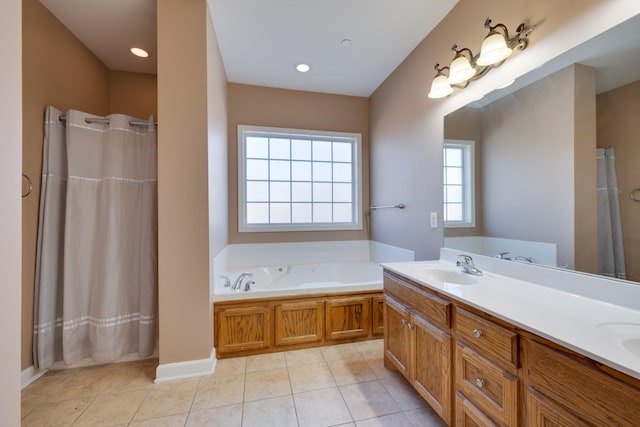 bathroom featuring tile patterned floors, vanity, and a tub to relax in