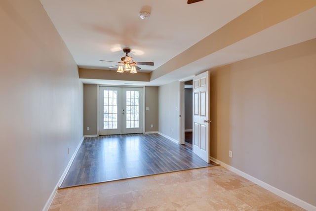 spare room with french doors and ceiling fan