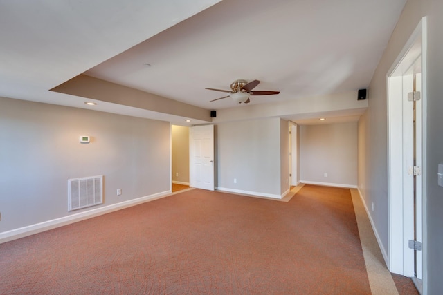 carpeted spare room with ceiling fan