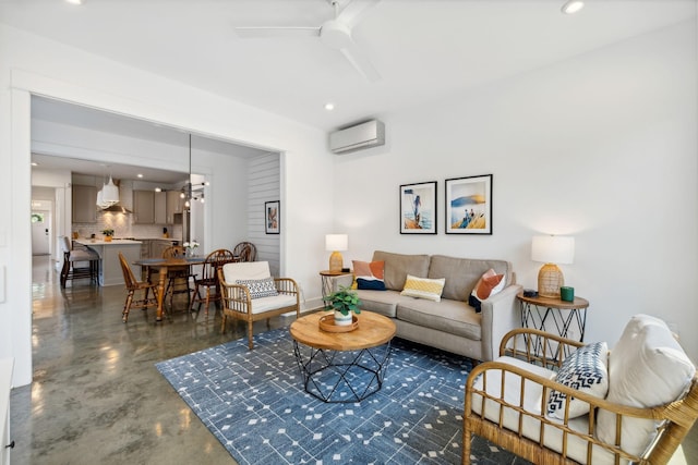 living room featuring ceiling fan and a wall unit AC