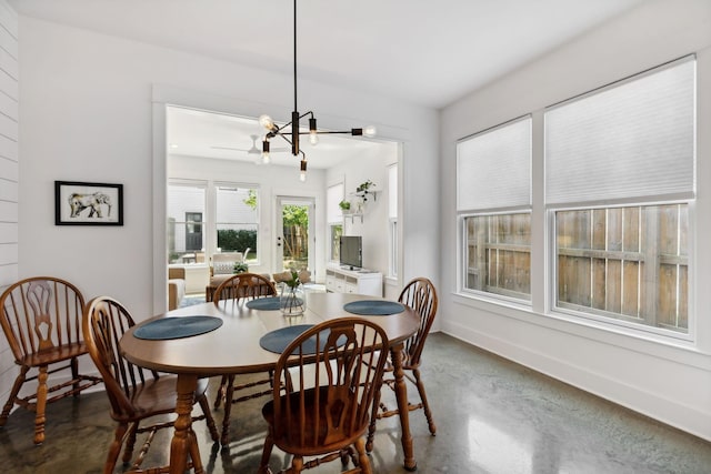 dining area featuring an inviting chandelier