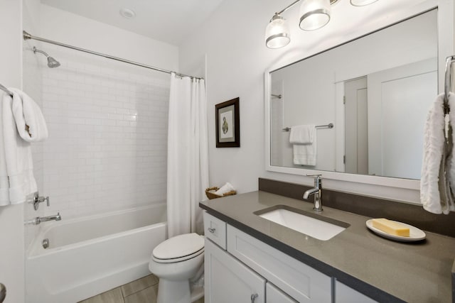 full bathroom featuring vanity, shower / bathtub combination with curtain, and toilet