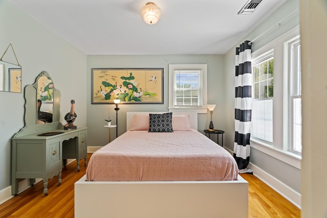 bedroom with light wood-type flooring