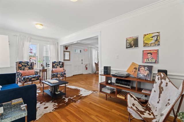 living room featuring ornamental molding and hardwood / wood-style flooring