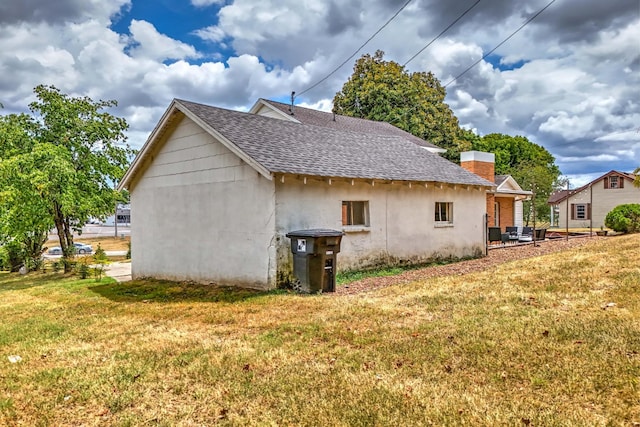 view of property exterior featuring a yard