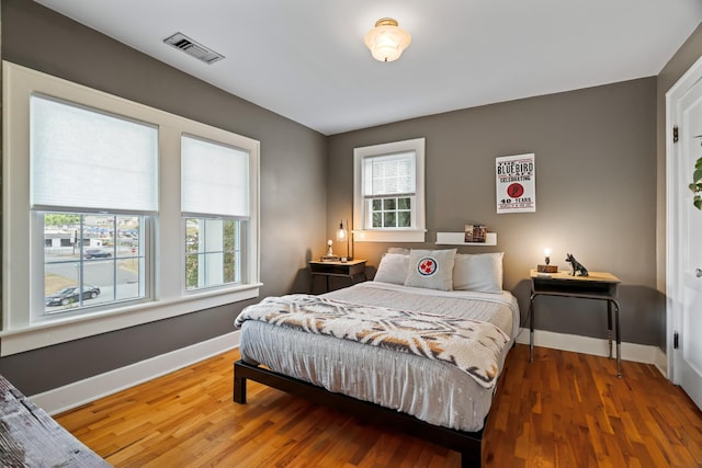 bedroom featuring wood-type flooring