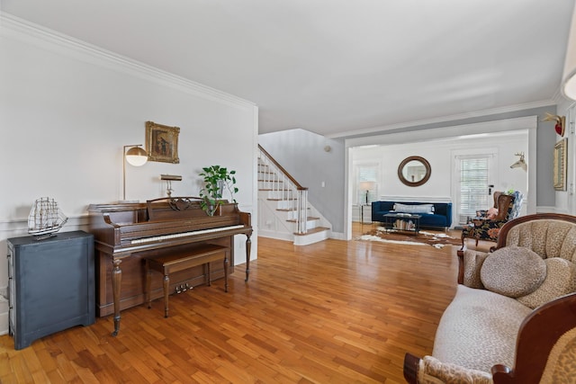 living room featuring hardwood / wood-style floors and ornamental molding