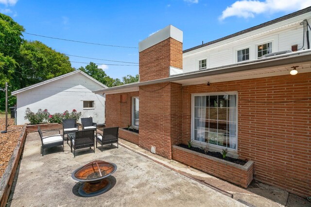 view of patio with a fire pit