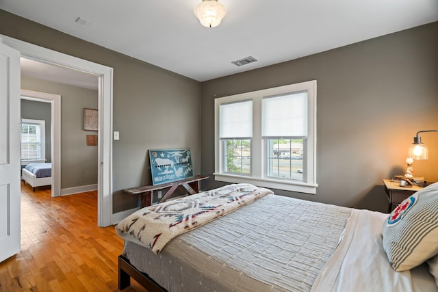 bedroom with wood-type flooring