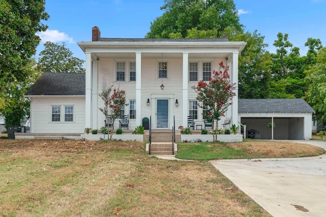 greek revival house featuring a front lawn