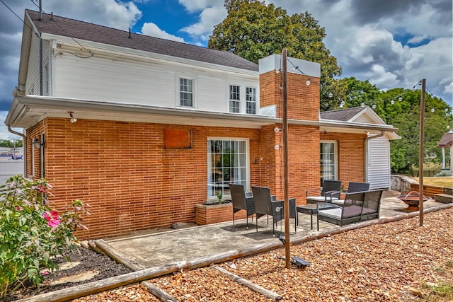 back of house with a patio and an outdoor hangout area