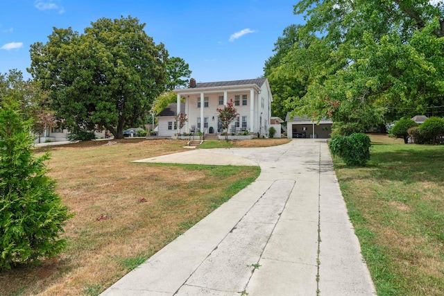 view of front of property featuring covered porch and a front yard