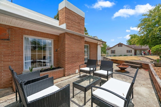 view of patio / terrace with a fire pit