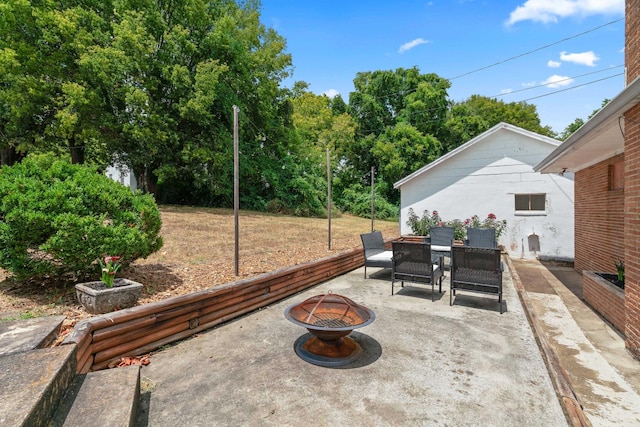 view of patio / terrace with an outdoor fire pit