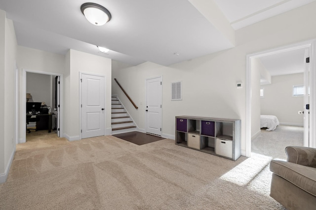 living room featuring light colored carpet