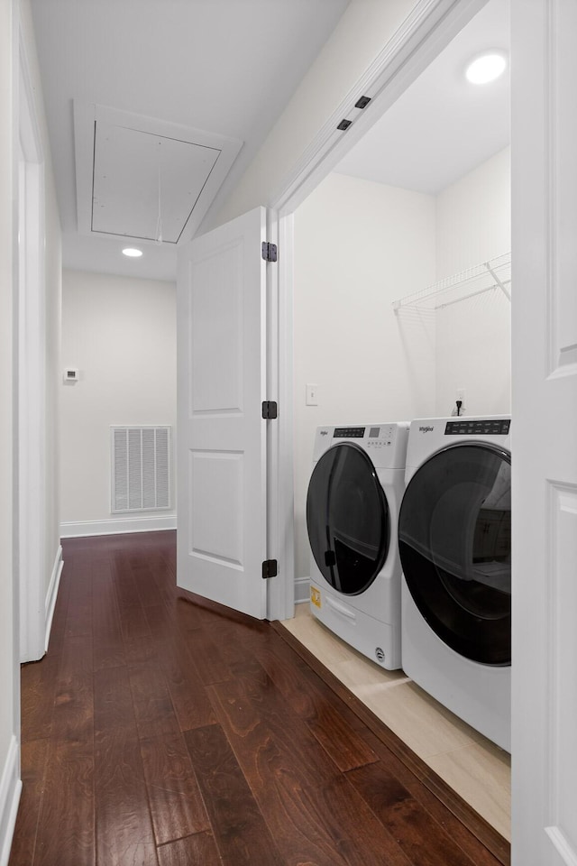 washroom featuring washer and dryer and dark hardwood / wood-style floors