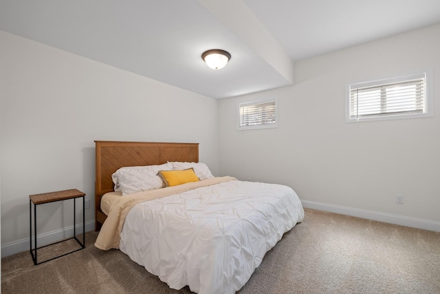 bedroom with carpet and multiple windows