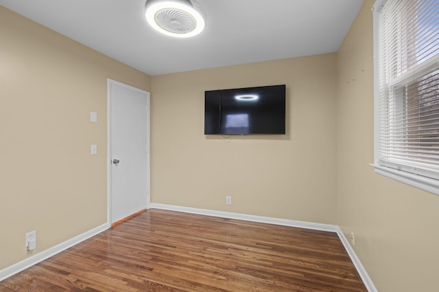 empty room with hardwood / wood-style floors