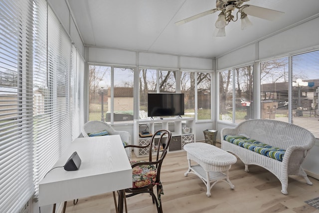 sunroom / solarium with ceiling fan