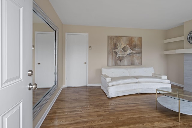 unfurnished living room with dark hardwood / wood-style flooring