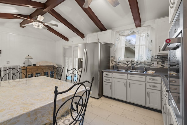 kitchen featuring white cabinets, decorative backsplash, sink, stainless steel fridge with ice dispenser, and lofted ceiling with beams