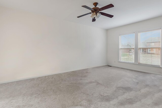 carpeted empty room with ceiling fan