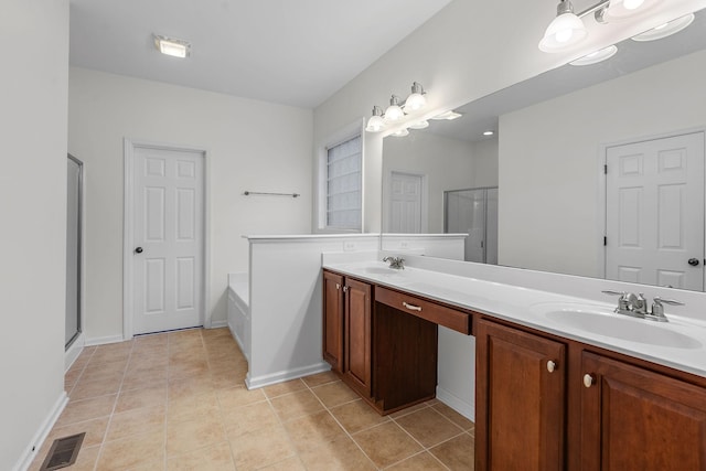 bathroom with shower with separate bathtub, vanity, and tile patterned floors