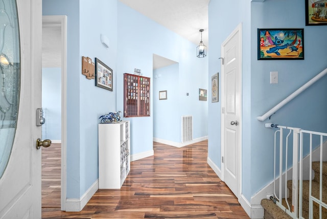 hall featuring dark wood-type flooring