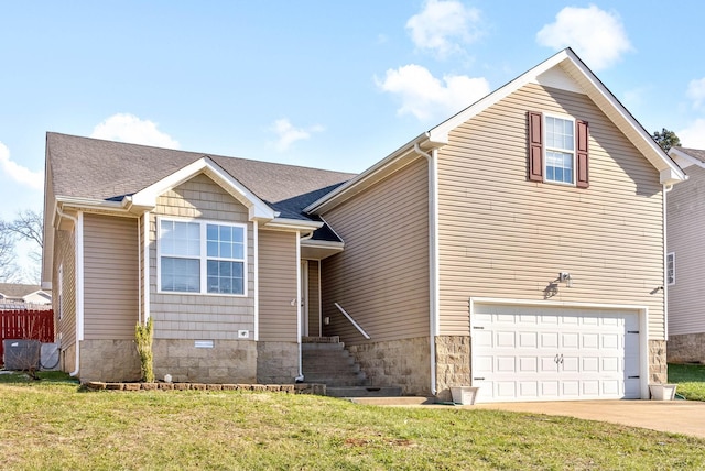 view of front facade with a front yard and a garage