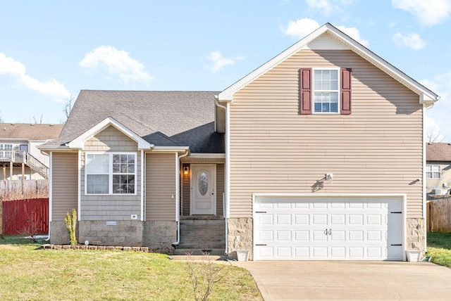 view of front of home with a garage and a front lawn